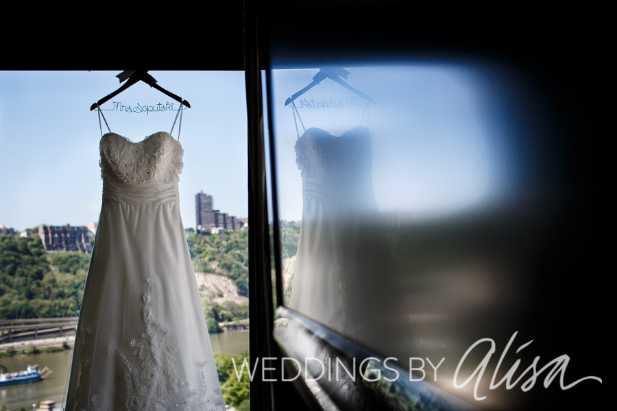 Bride dress hanging in window of downtown Pittsburgh hotel